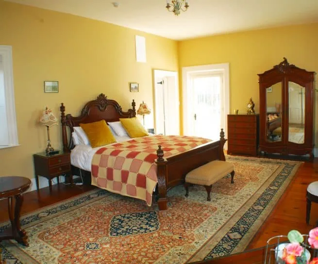 Chambord — luxury accommodation at Clonganny House Wexford, with terracotta tones and warm walnut furniture