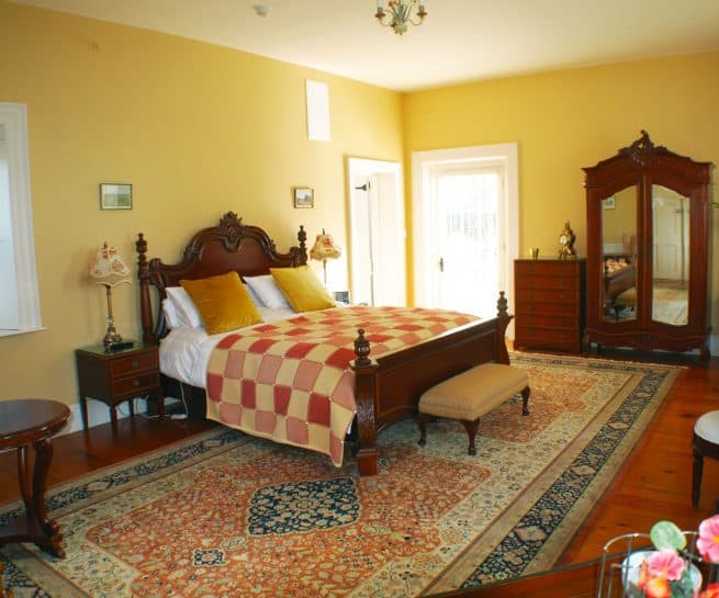 Chambord Suite at Clonganny House Wexford — quilted bed, walnut furniture, patio doors and flat screen smart TV