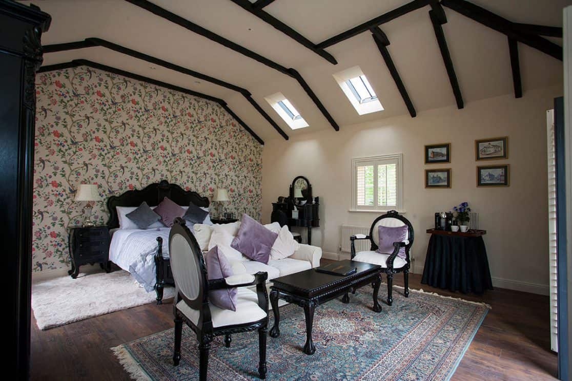 Cheverney Suite bedroom at Clonganny House Wexford — antique black furniture and super king size bed