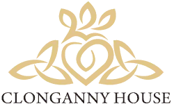 Historic Clonganny House with lush gardens and traditional architecture.