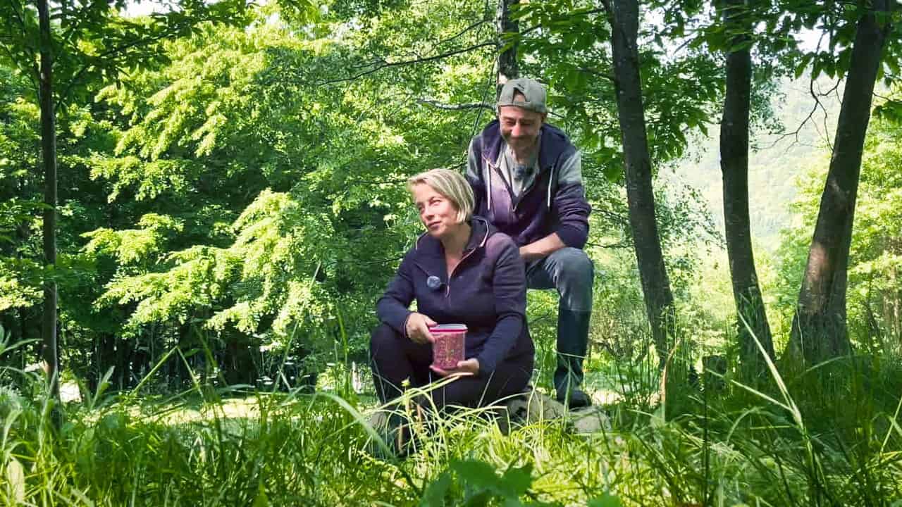 Beautiful outdoor scene at Clonganny House with two people enjoying the lush green surroundings.