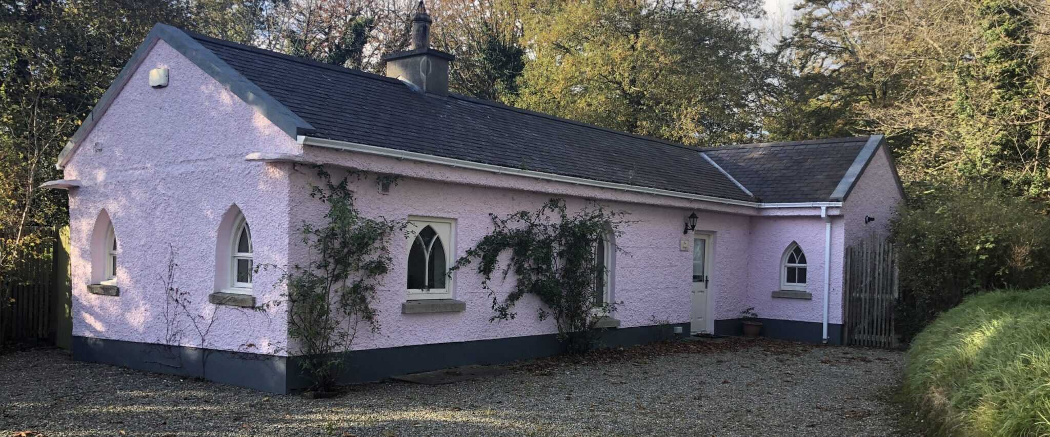 Charming pink gate lodge at Clonganny House estate.
